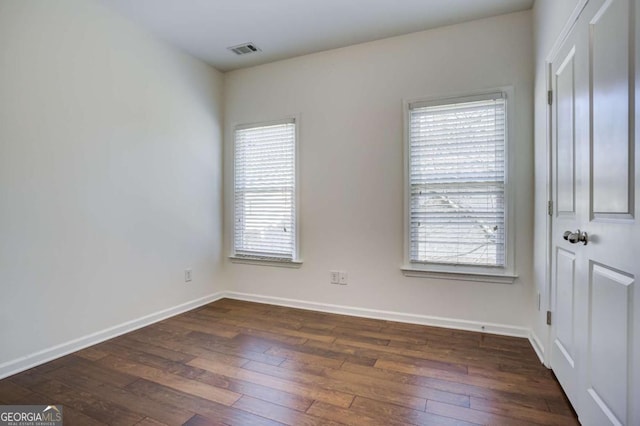 empty room featuring dark hardwood / wood-style floors