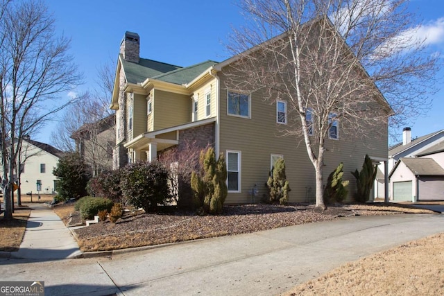 view of side of property with a garage