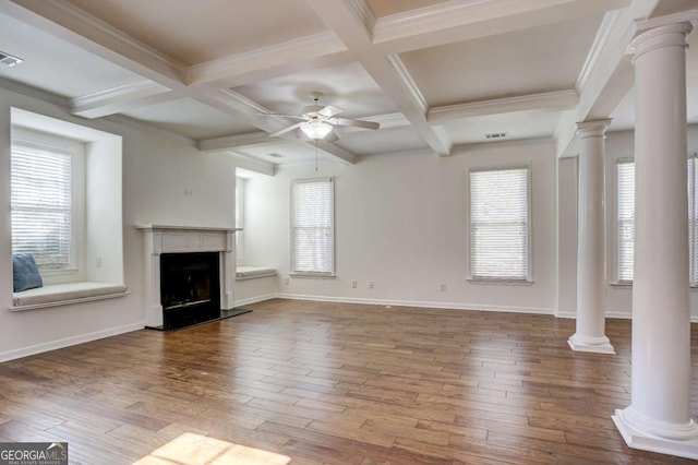 unfurnished living room with hardwood / wood-style floors, decorative columns, a healthy amount of sunlight, and ceiling fan