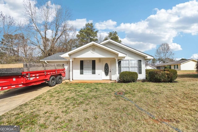 view of front of home featuring a porch and a front lawn