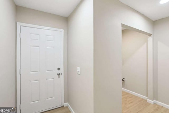 doorway with light hardwood / wood-style flooring