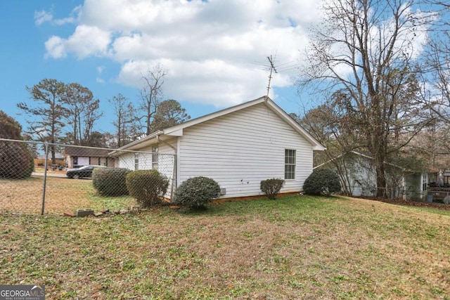 view of property exterior with a lawn