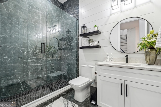 full bathroom with a shower stall, toilet, vanity, and marble finish floor