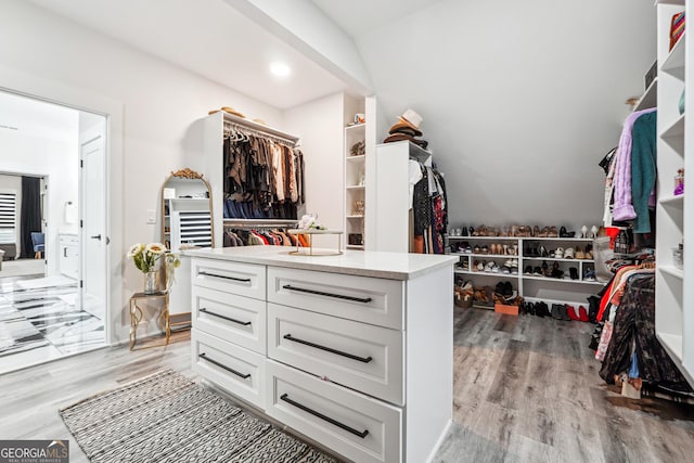 walk in closet featuring light wood finished floors