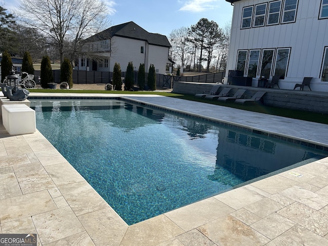 view of pool with a patio, a fenced in pool, and fence