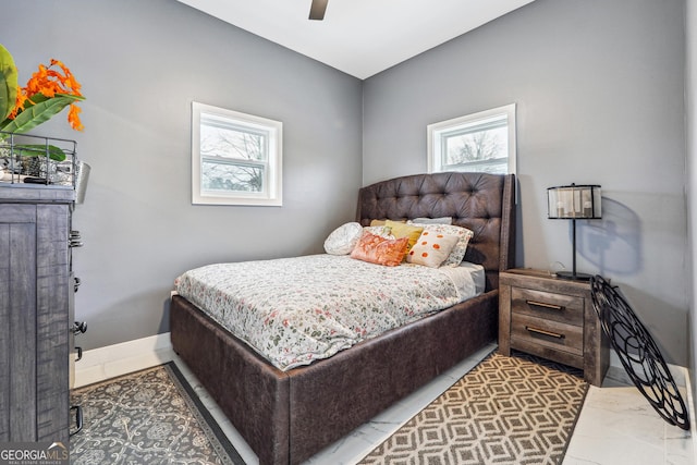 bedroom featuring ceiling fan and baseboards