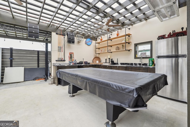 rec room featuring billiards, bar, and finished concrete floors