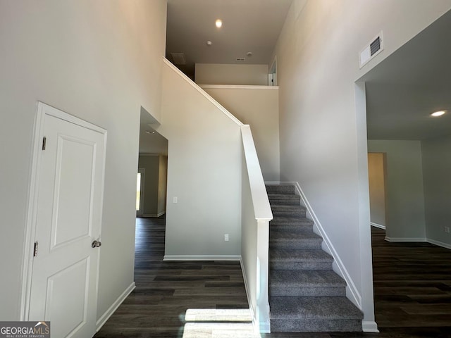 stairway featuring wood-type flooring