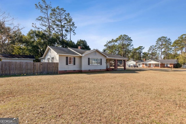 single story home with a front yard