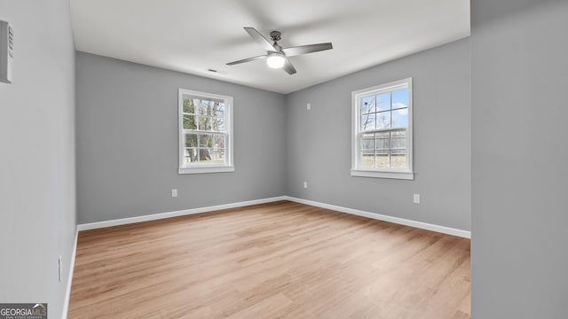 empty room featuring light hardwood / wood-style floors and ceiling fan