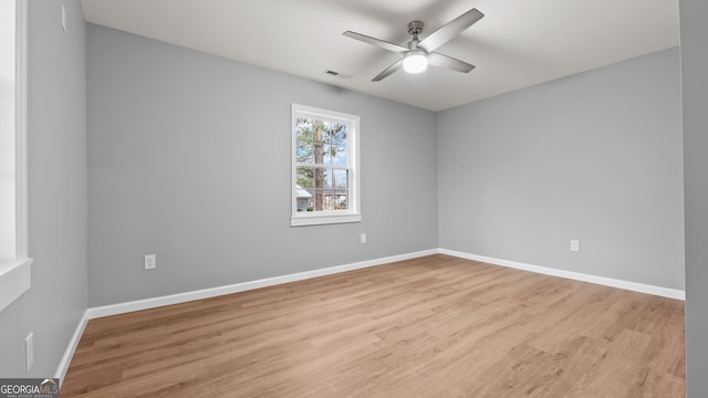 spare room featuring ceiling fan and light wood-type flooring