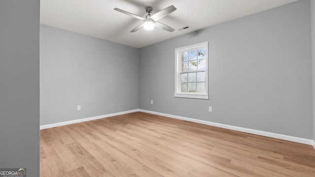 unfurnished room featuring light hardwood / wood-style flooring and ceiling fan