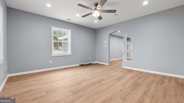 empty room featuring ceiling fan and light wood-type flooring