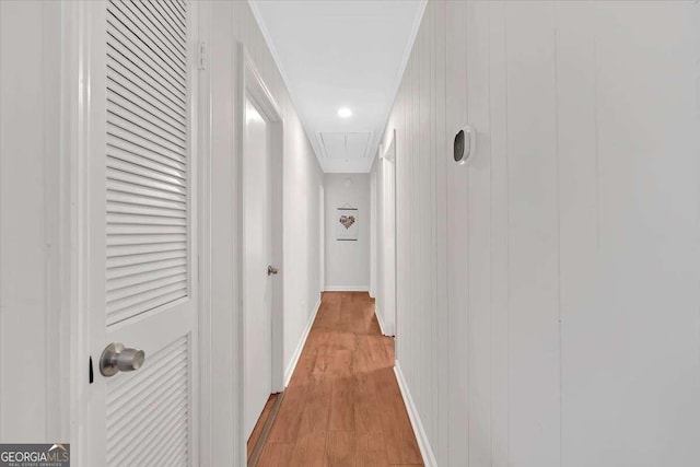 corridor with light hardwood / wood-style flooring