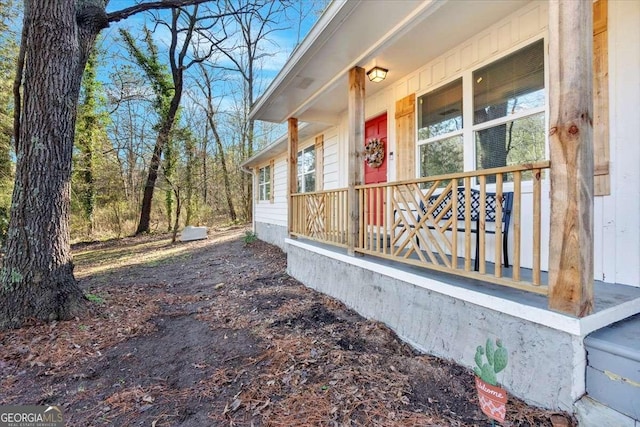 view of side of property with covered porch