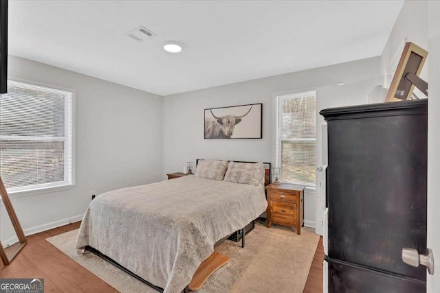 bedroom featuring light wood-type flooring