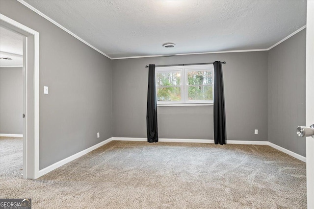 unfurnished room with ornamental molding, light carpet, and a textured ceiling