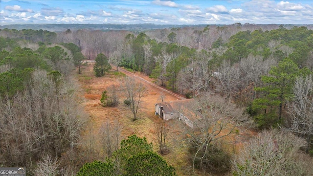 drone / aerial view with a view of trees