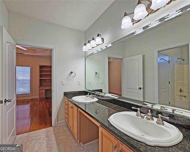 bathroom featuring tile patterned flooring and vanity