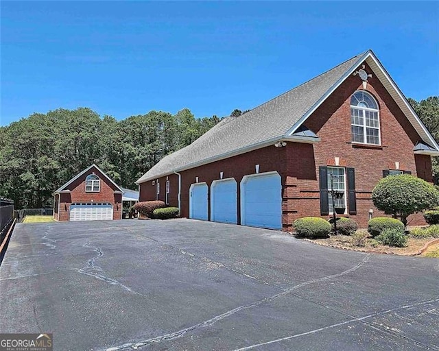 view of side of property featuring a garage