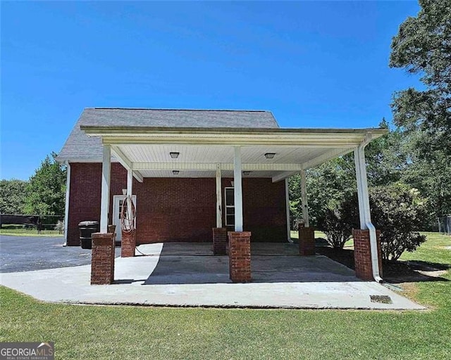 view of property's community featuring a yard and a patio area