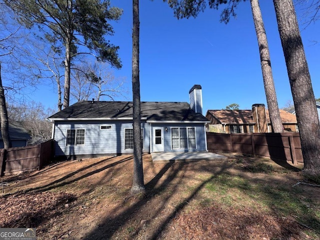 rear view of property featuring a patio area