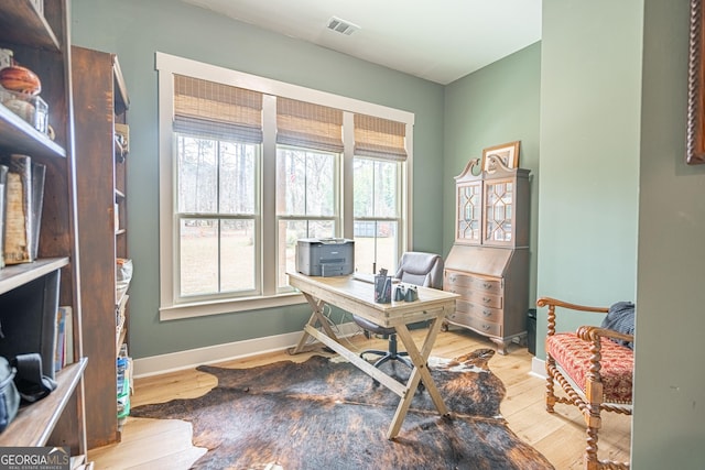 home office with light wood-type flooring