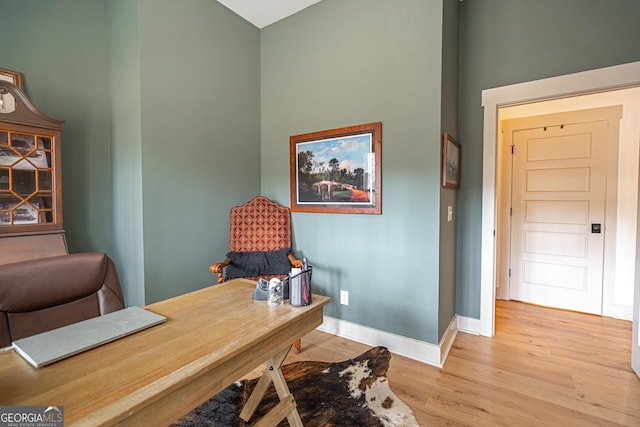 office space with light hardwood / wood-style flooring