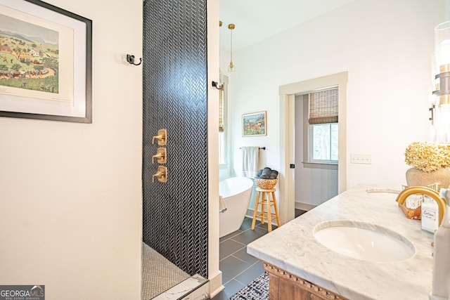 bathroom featuring vanity, tile patterned floors, and shower with separate bathtub