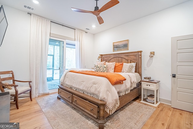 bedroom with light hardwood / wood-style flooring, access to outside, and ceiling fan