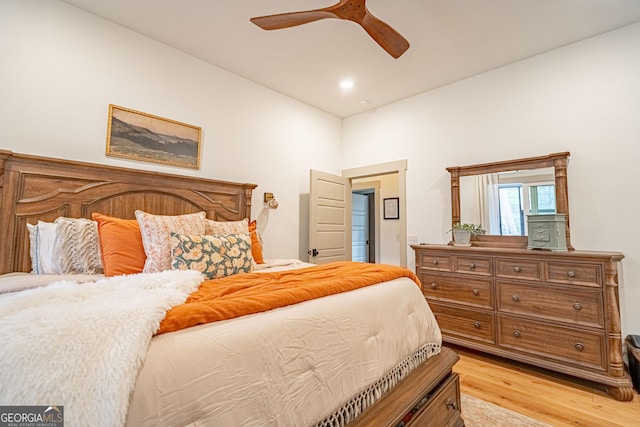 bedroom with ceiling fan and light hardwood / wood-style flooring