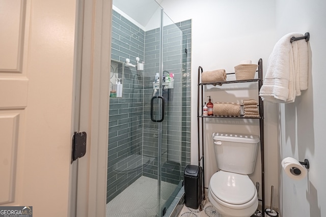 bathroom with toilet and walk in shower