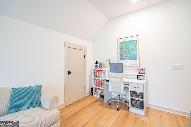 office area with lofted ceiling and light hardwood / wood-style flooring