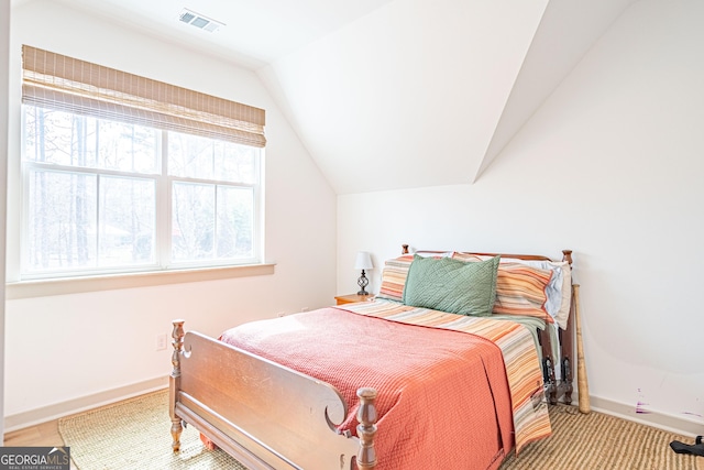 bedroom featuring vaulted ceiling