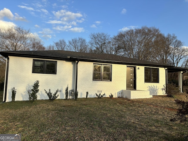 single story home with crawl space, a front lawn, and brick siding