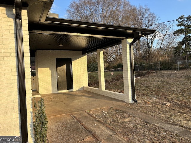 view of patio / terrace featuring fence