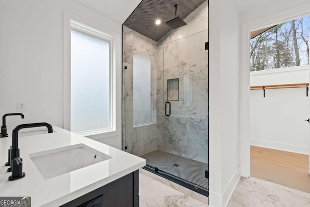 bathroom with vanity, vaulted ceiling, and a shower with door