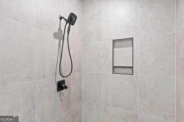 details with a tile shower