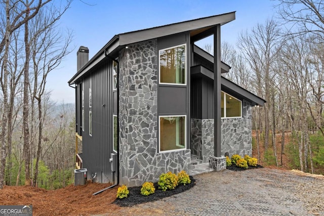 view of home's exterior with central AC unit