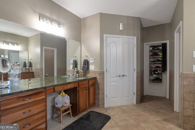 bathroom featuring tile walls, vanity, and tile patterned floors