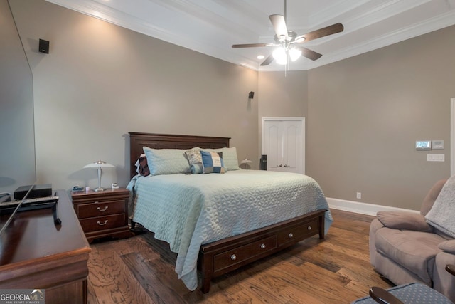 bedroom featuring ornamental molding, dark hardwood / wood-style floors, and ceiling fan