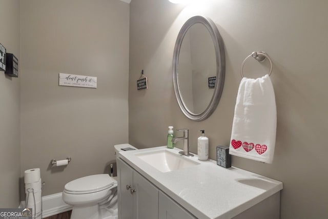 bathroom with vanity and toilet