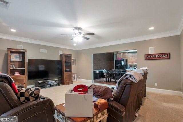 carpeted living room featuring crown molding and ceiling fan