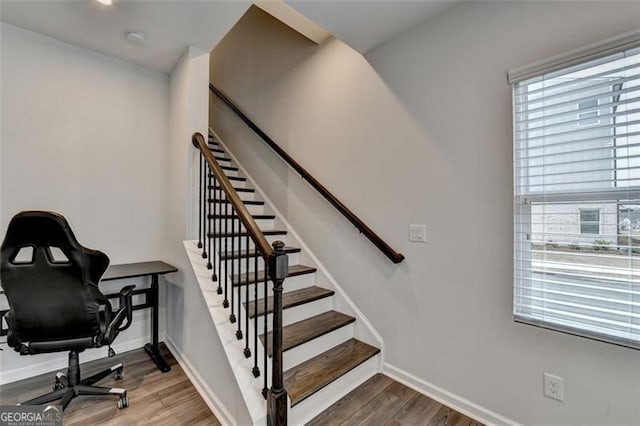 stairway featuring hardwood / wood-style floors