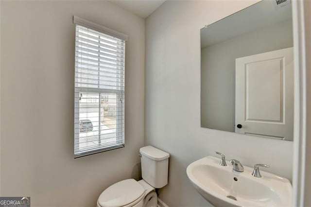 bathroom with sink and toilet