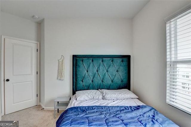 bedroom with light colored carpet