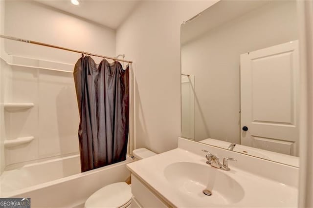 full bathroom featuring vanity, shower / bathtub combination with curtain, and toilet