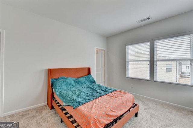 bedroom with light carpet