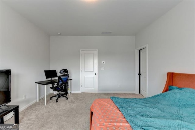 bedroom featuring light carpet