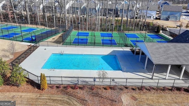 view of pool featuring tennis court